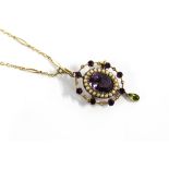 Early 20th century Suffragette brooch / pendant, set with amethysts, seed pearls and a peridot drop,