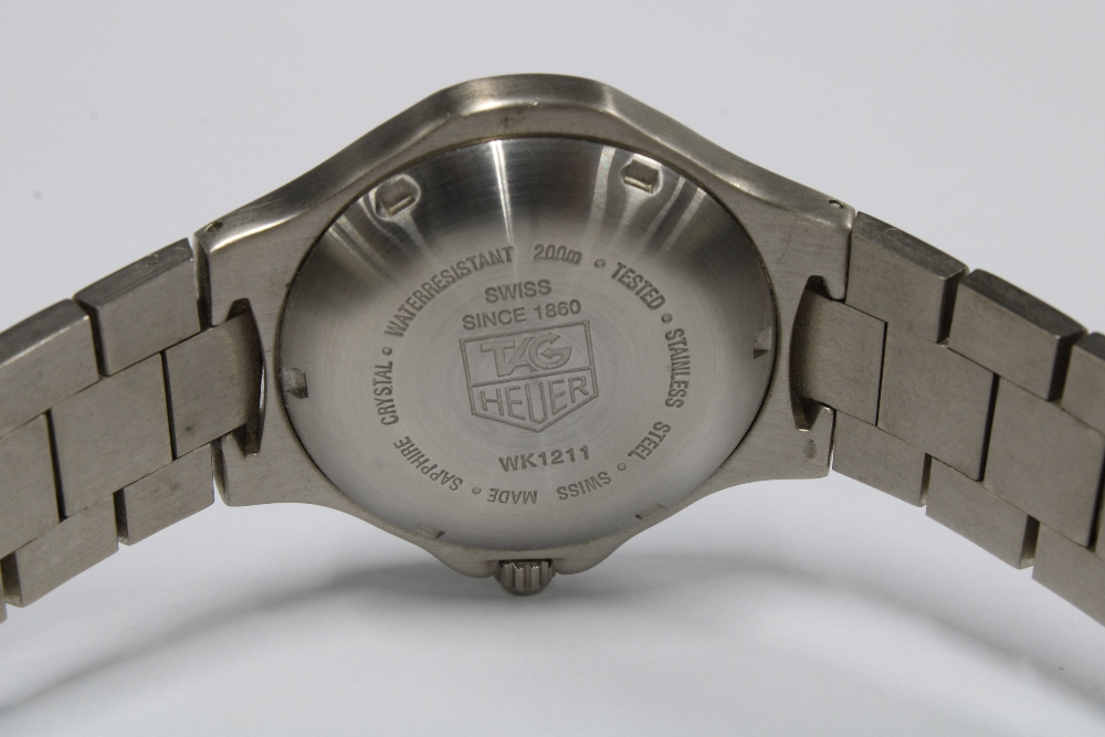 A gents Tag Heuer Stainless Steel Quartz Chronometer bracelet wristwatch, black signed dial and date - Image 2 of 4