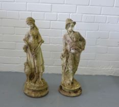 Companion male and female garden statues, 25 x 62cm. (2)