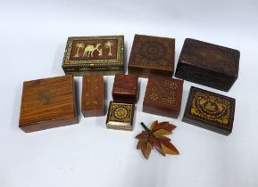 A collection of inlaid wooden boxes and a woden leaf (10)