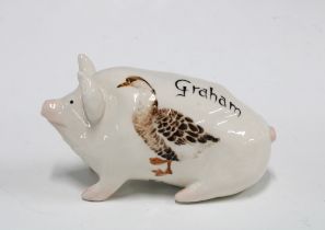 Griselda Hill Pottery pig, painted with a duck and named Graham, with painters initials ES, 15cm.