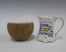 Mug commemorating the liberation of the Falkland Islands, 10cm, together with a studio pottery