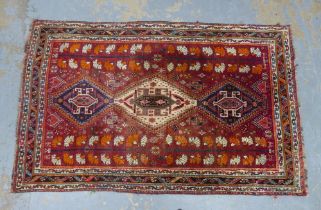 Persian Qashqai rug with red field and three lozenge medallions,within multiple borders, 252 x