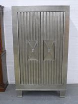 Contemporary silvered armoire opening to reveal a shelved interior, likely by Andrew Martin, 110 x