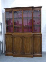 Mahogany breakfront bookcase cabinet with four glazed doors over four panelled doors, plinth base,