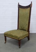 Aesthetic Movement walnut upholstered nursing chair, the high back with a carved and dished top rail