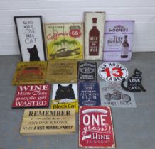 A quantity of wooden and tin wall plaques to include 'All you need is love and a cat' and 'Founder