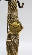 TISSOT, Ladies vintage 9ct gold wristwatch on a 9ct gold bracelet strap