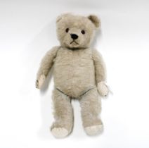 Early French musical mohair teddy bear, with slight sign of original blue colour, 46cm long