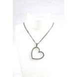 14ct white gold diamond set heart pendant on a double trace link chain, stamped 14k