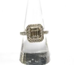 18ct white gold diamond dress ring with six emerald cut diamonds within a surround of small