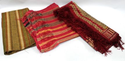 Three Indian textiles with silk threads and tassels, longest is approx 325cm x 88cm, (3) (dark red