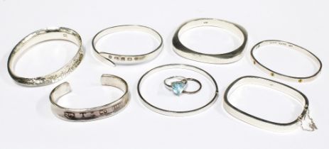 Seven contemporary silver bangles to include one inscribed Tiffany & Co, together with a silver