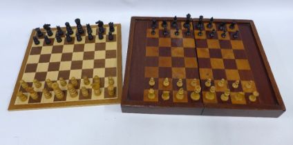 Two chess sets with folding chess boards, one with backgammon markings on the reverse, 48 x 38cm
