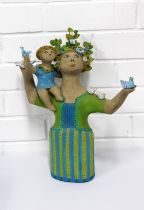 BIDDY PICARD (1922-2019) Stoneware figure of a woman with flowers in her hair and a child sat upon