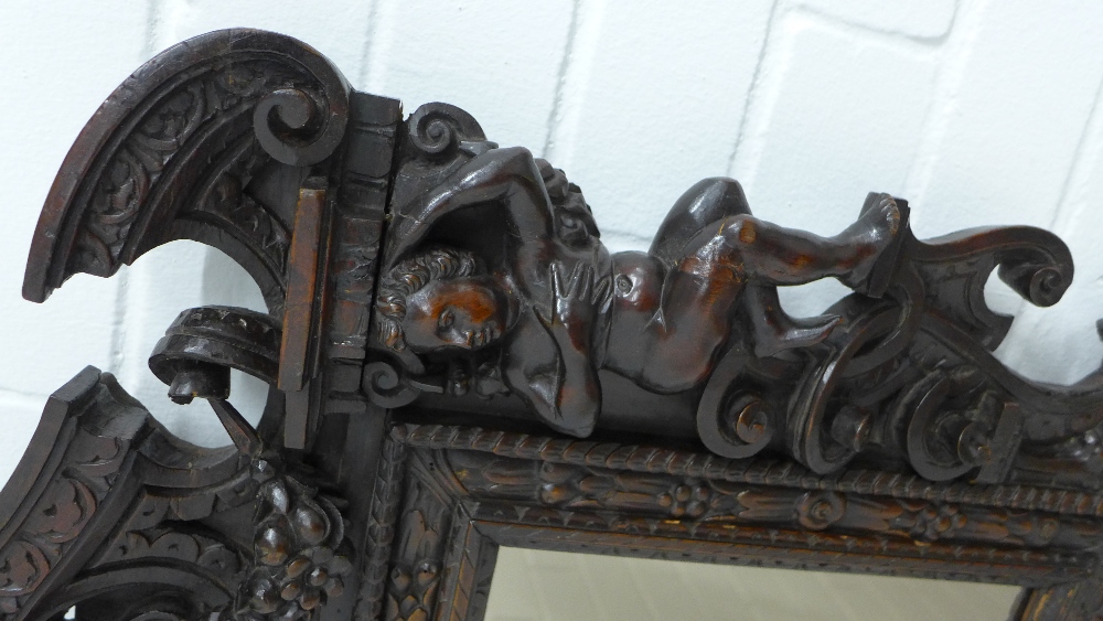Baroque Revival carved wall mirror, with mask heads, cherubs and broken pediment top, 57 x 65cm. - Image 3 of 3