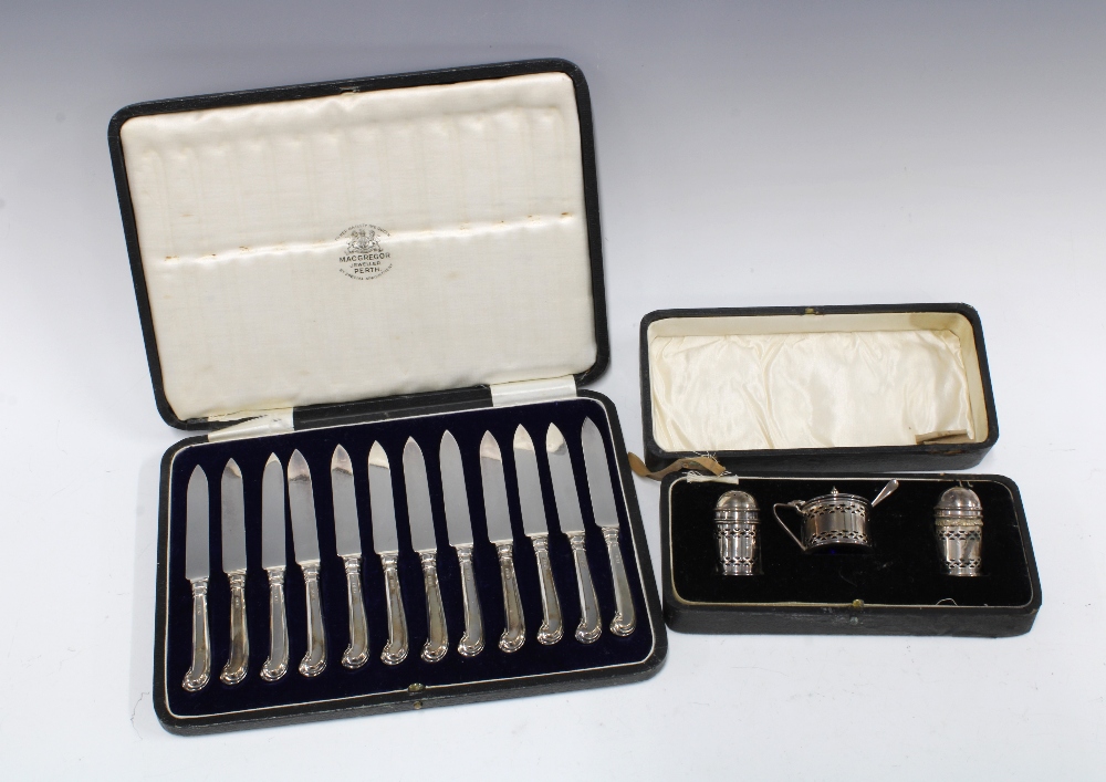 Cased set of twelve silver fruit knives, Sheffield 1928, together with Birmingham silver three piece