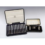 Cased set of twelve silver fruit knives, Sheffield 1928, together with Birmingham silver three piece