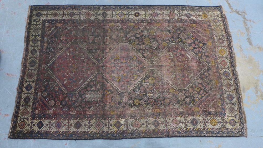 Late 19th / early 20th century Persian rug, three hooked medallions to a foliate ground within - Image 2 of 6
