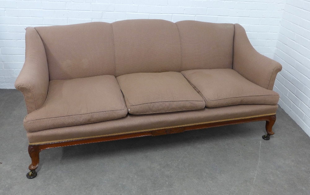 Three seater settee on short cabriole legs with shell carving and brass castors, 192 x 84 x 55cm.