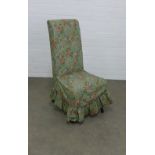 High back chair with loose green floral cover, 50 x 101cm.