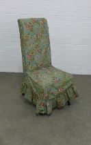 High back chair with loose green floral cover, 50 x 101cm.