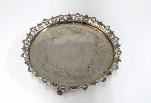 Portuguese salver with pierced acanthus rim and engraved central pattern, standing on three paw