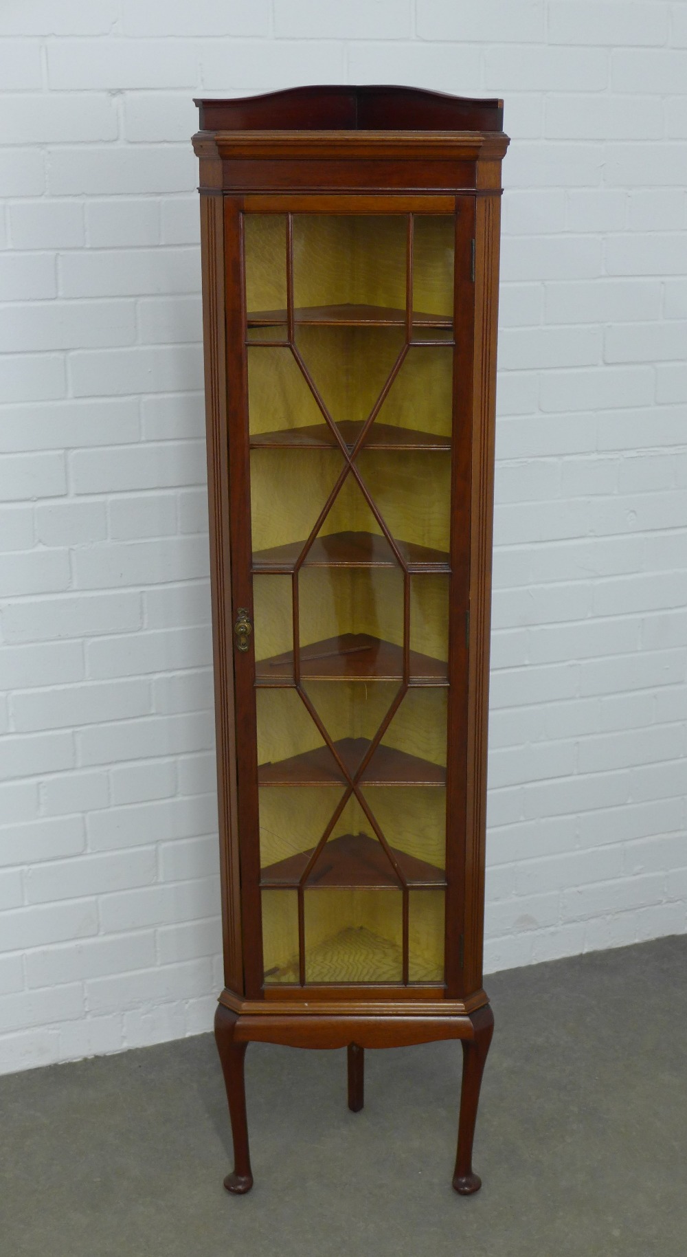 Mahogany floor standing corner cupboard, long and slender proportions with astragal glazed door