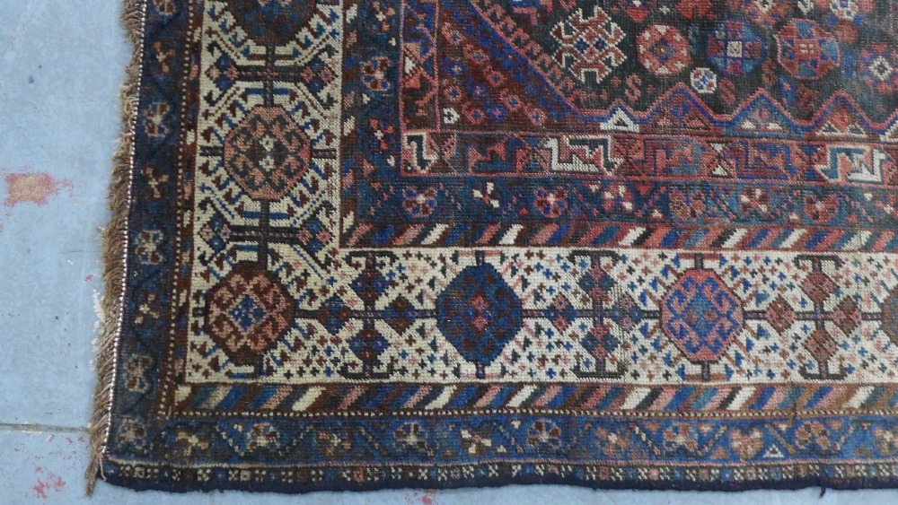 Late 19th / early 20th century Persian rug, three hooked medallions to a foliate ground within - Image 4 of 6