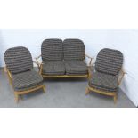 Ercol vintage blonde elm three piece suite, comprising a two seater stick back settee and pair of