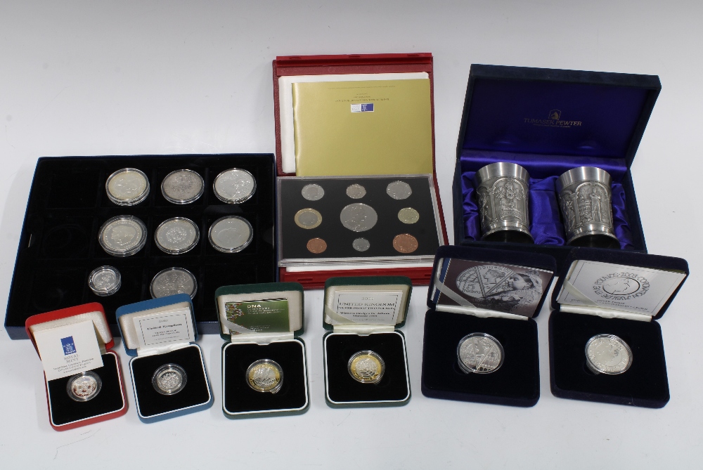 A collection of boxed set commemorative coins and a pair of pewter vases, etc (a lot)