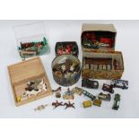 A collection of vintage lead figures together with a Hornby tinplate station shop and accessories