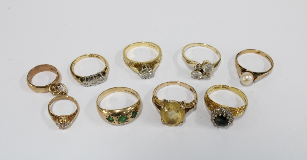 Three 18ct gold dress rings and four 9ct gold rings together with a 9ct gold charm with two