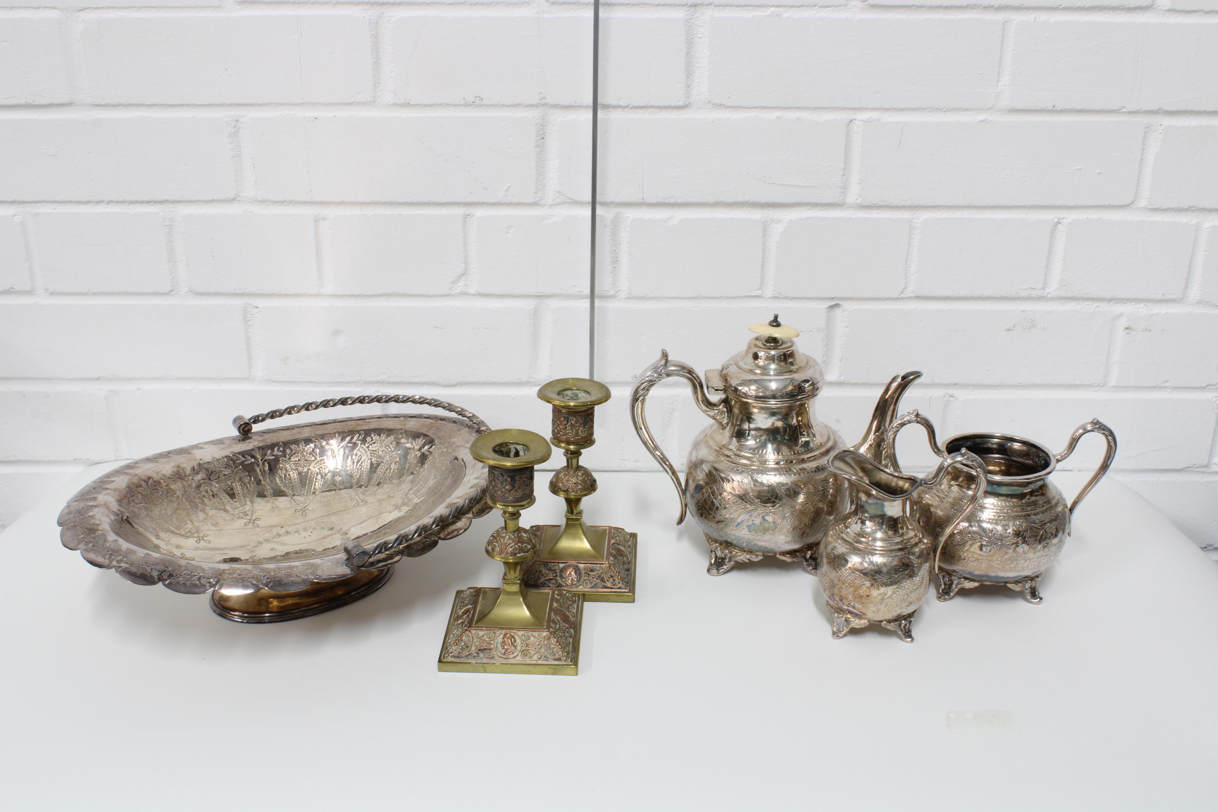 Silver plated tea set and dish, together with a pair of brass and copper candlesticks (6)