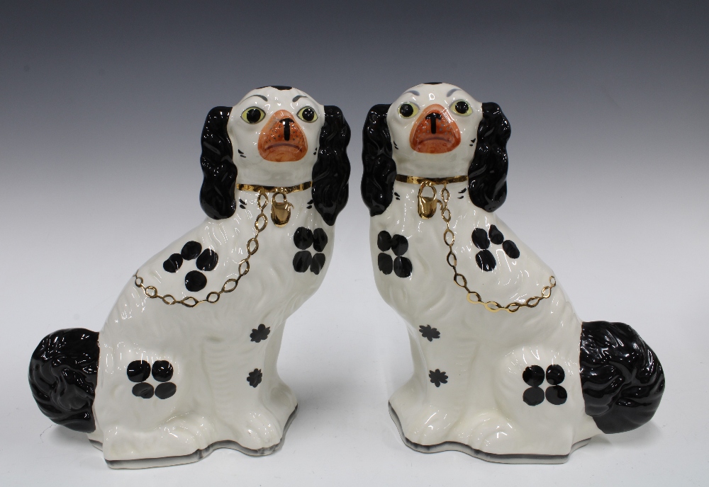 Pair of black and white pottery chimney spaniels by Wood (2) 28cm