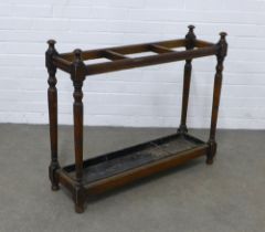 Early 20th century stained pine stick stand, three divisions with original metal drip tray, 87 x