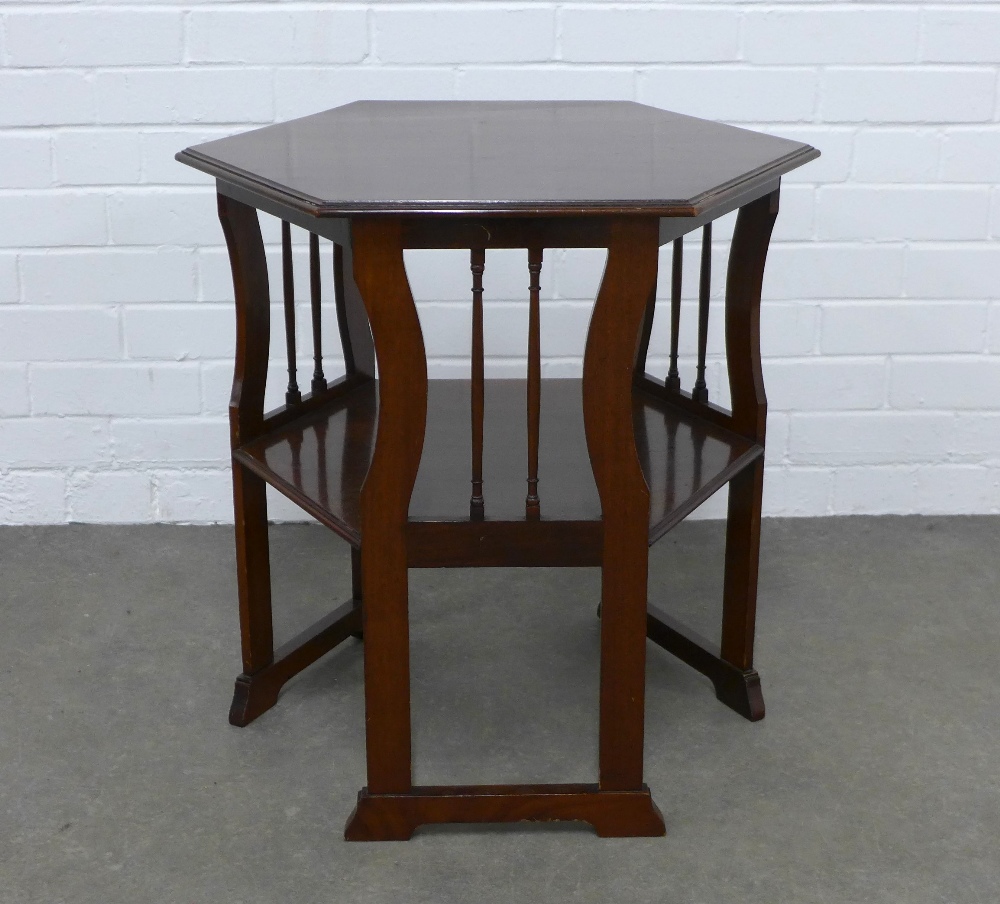 WITHDRAWN Edwardian hexagonal mahogany table with an undertier, raised on shaped legs with low