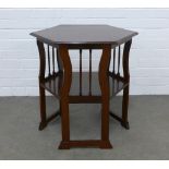 WITHDRAWN Edwardian hexagonal mahogany table with an undertier, raised on shaped legs with low