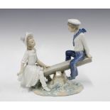 Lladro seesaw figure group, 24cm together