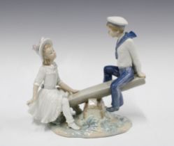 Lladro seesaw figure group, 24cm together