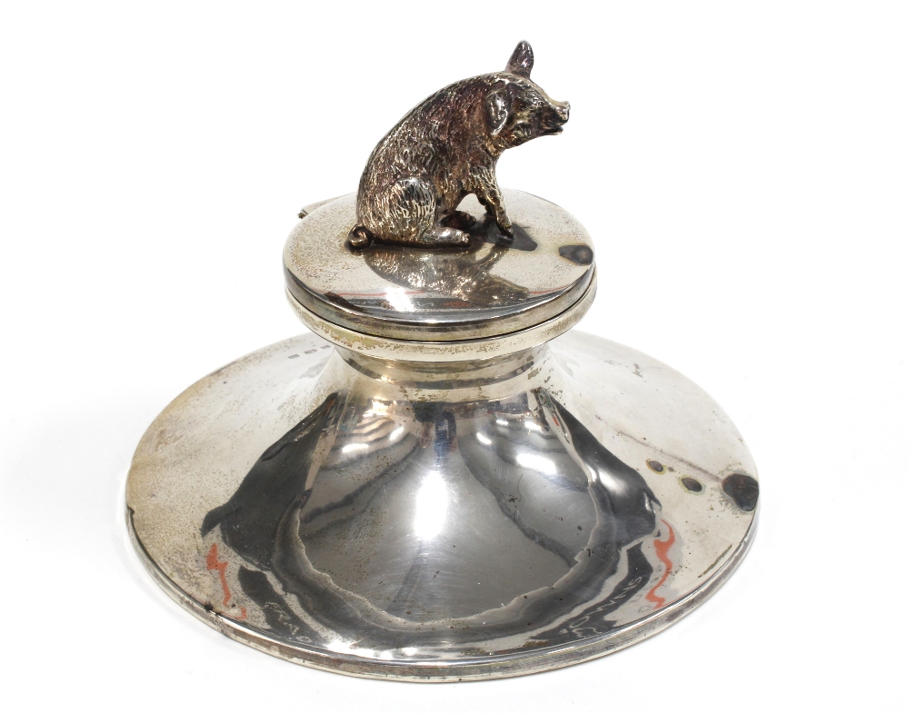 George V silver desk inkwell, the cover with a pig, Birmingham 1911, retailed by Barrett & Sons,