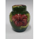 Moorcroft hibiscus pattern vase and cover, green ground, impressed marks, 16cm