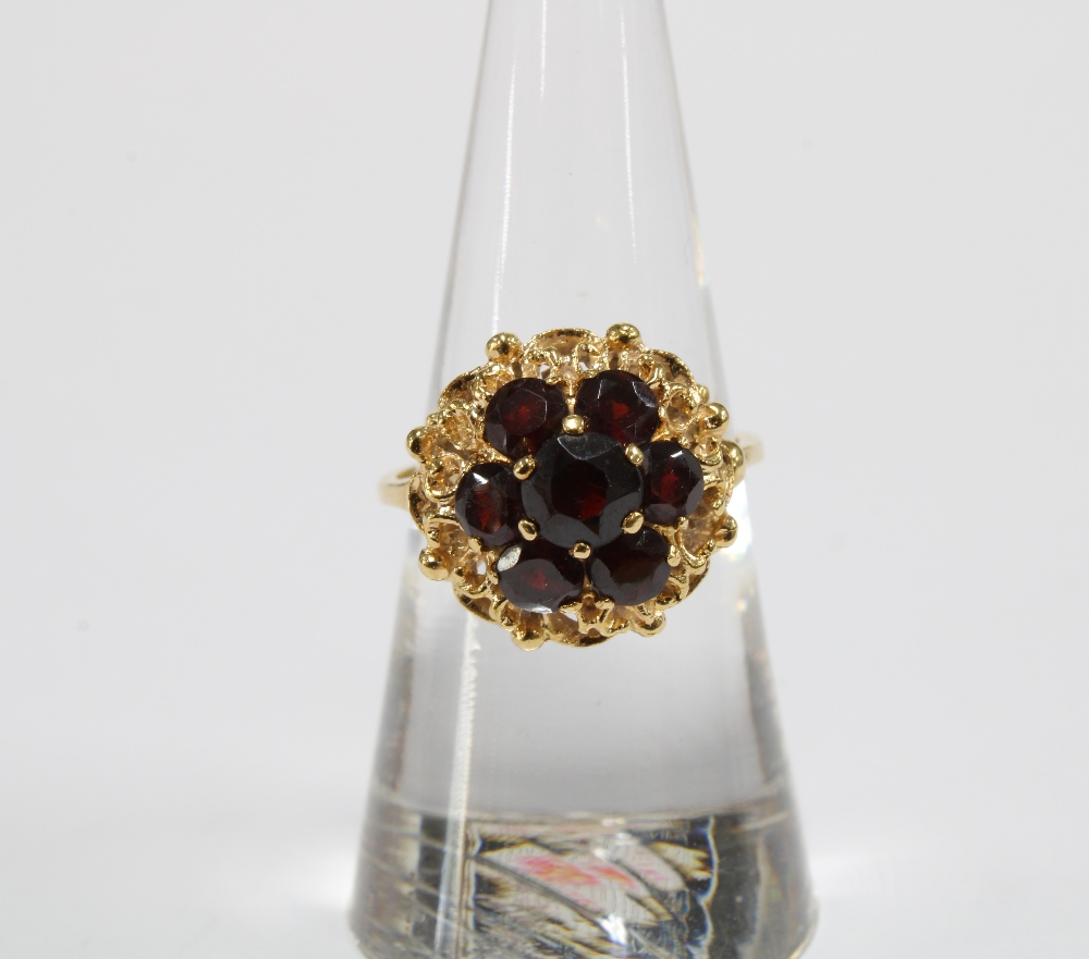 18ct gold bracelet with eleven panels, each with a group of seven garnets in a flowerhead setting, - Image 5 of 8