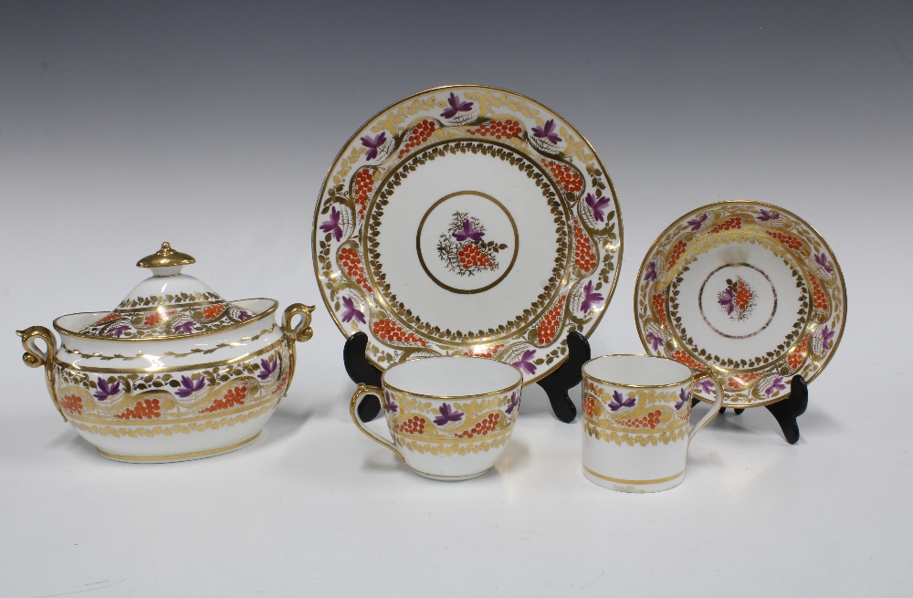 An early 19th century Miles Mason part teaset with orange, puce and gilt fruit and vine pattern,