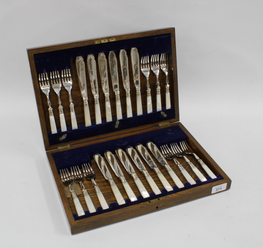 Oak canteen with a set of twelve mother of pearl and Epns fish knives and forks