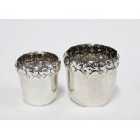 Two Danish silver plated beakers with stylised repoussé rims, he base stamped 'DFA Denmark',