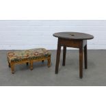 Vernacular stool / side table with an oval top and hand hole to centre, together with fruitwood