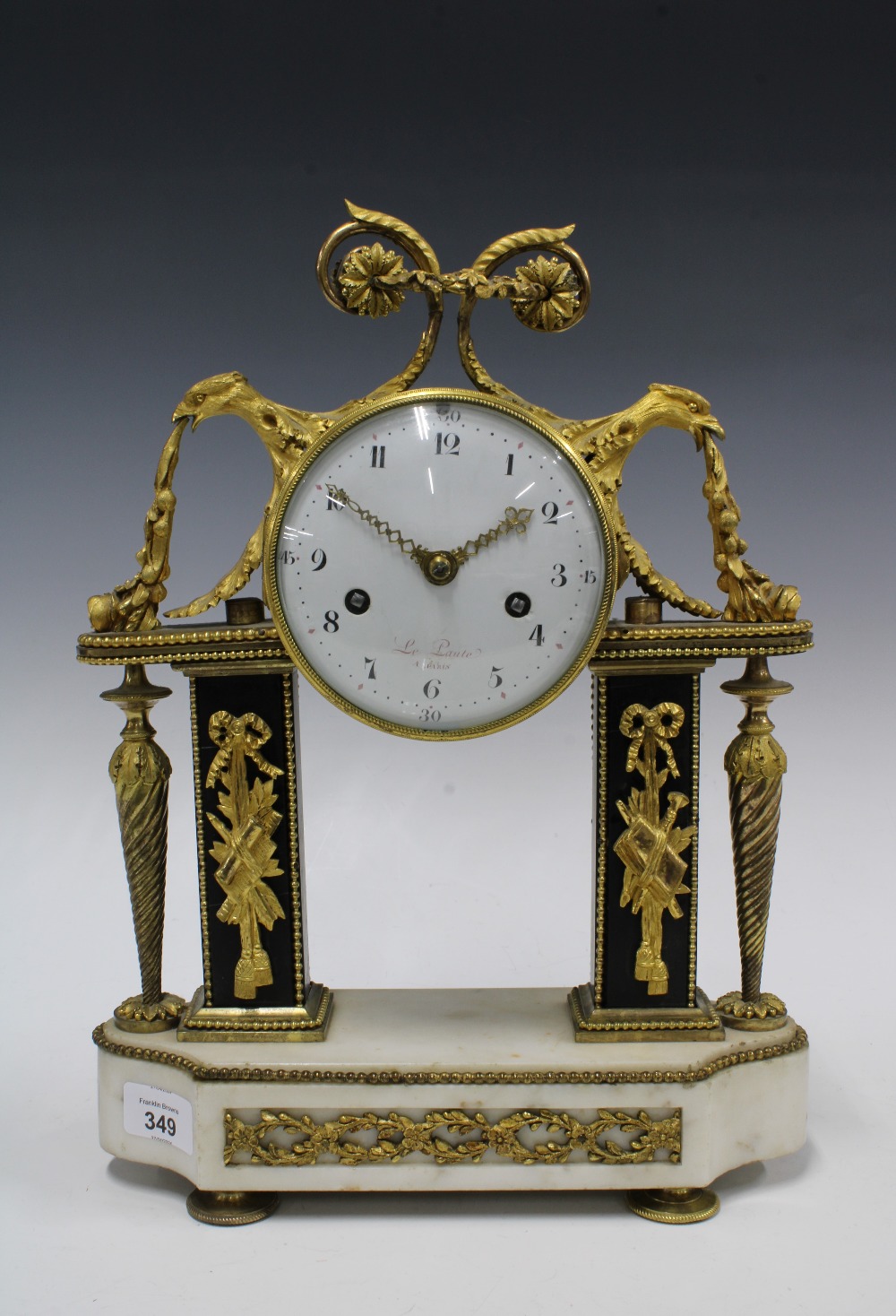 French Louis XVI style mantle clock with white enamel dial signed Le Paute, A Paris, on a white