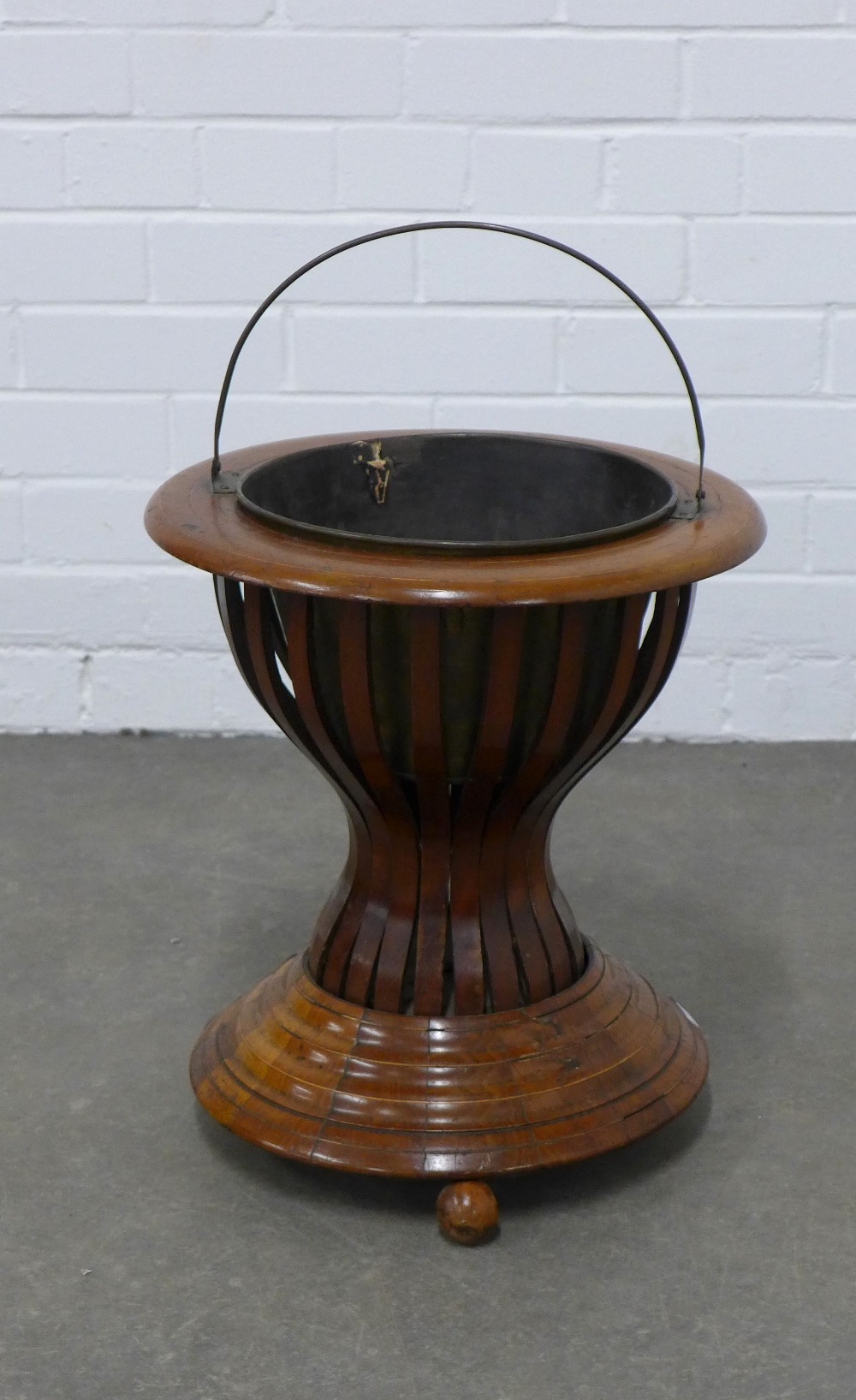 19th century mahogany peat / oyster bucket, hourglass form with metal liner and standing on bun