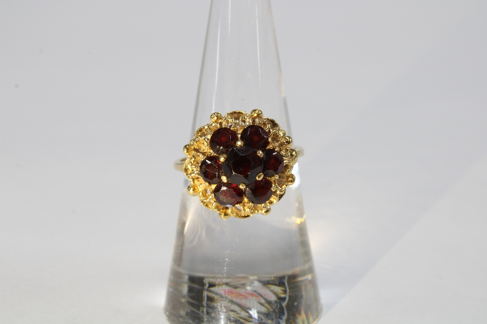18ct gold bracelet with eleven panels, each with a group of seven garnets in a flowerhead setting, - Image 6 of 8